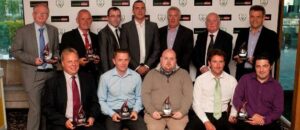 Bottom row, to the left, Edd Kealy & Dave Hooper pose with the award.