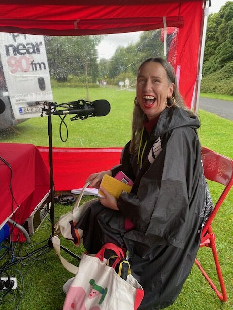 Near FM Pop-Up radio studio and path in St Anne's Park, Rose Festival July 2024. Pictured to the right: Jan Brierton, Dublin poet and spoken word artis